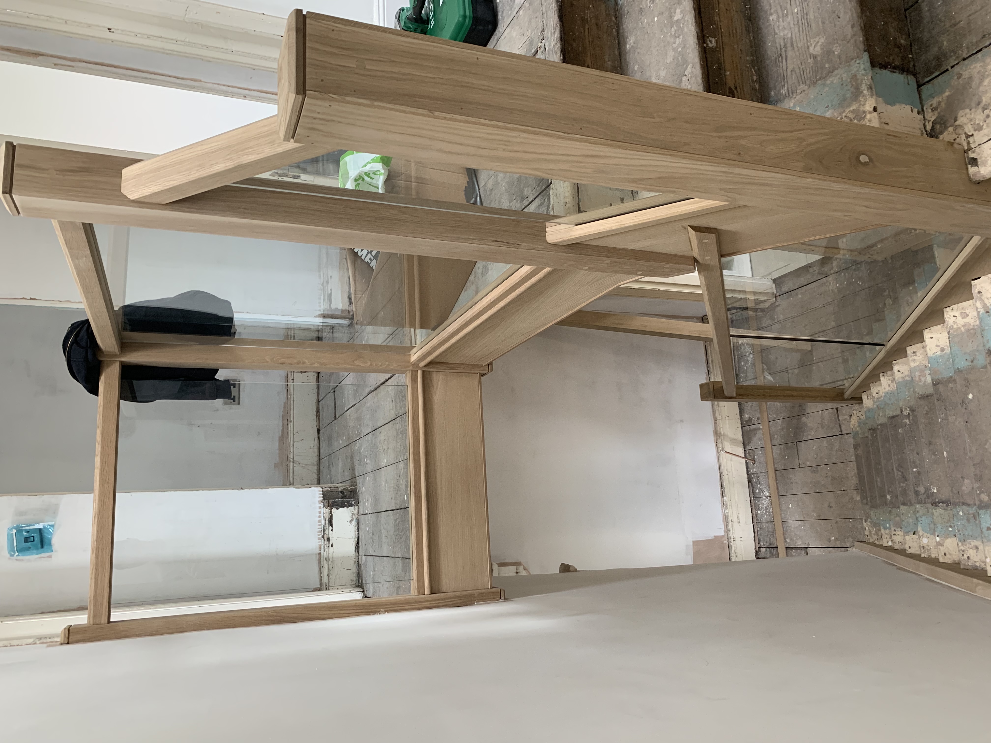 Oak cladded stair with oak and glass balustrade