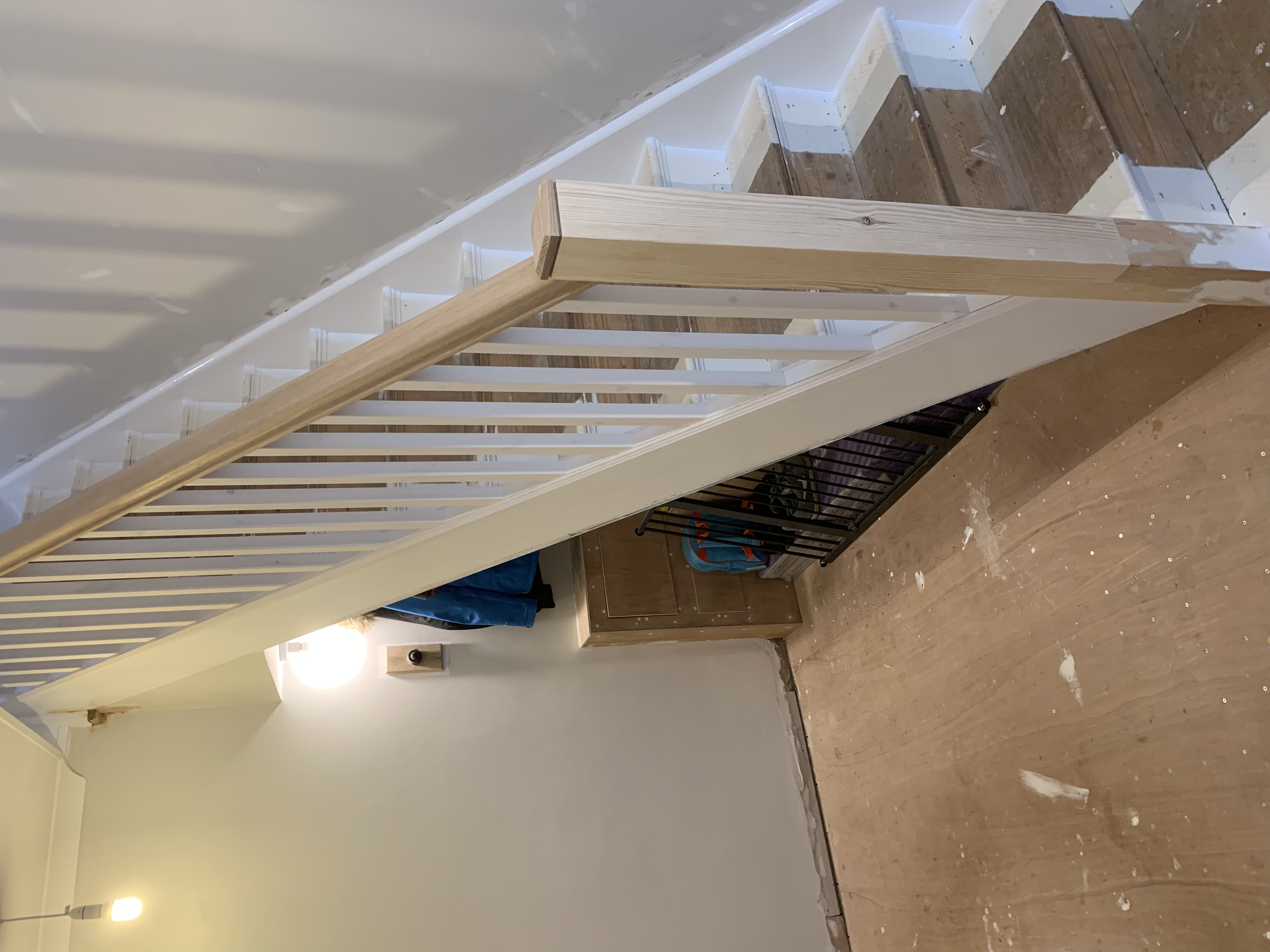 Oak handrail and caps with primed square spindles and baserail