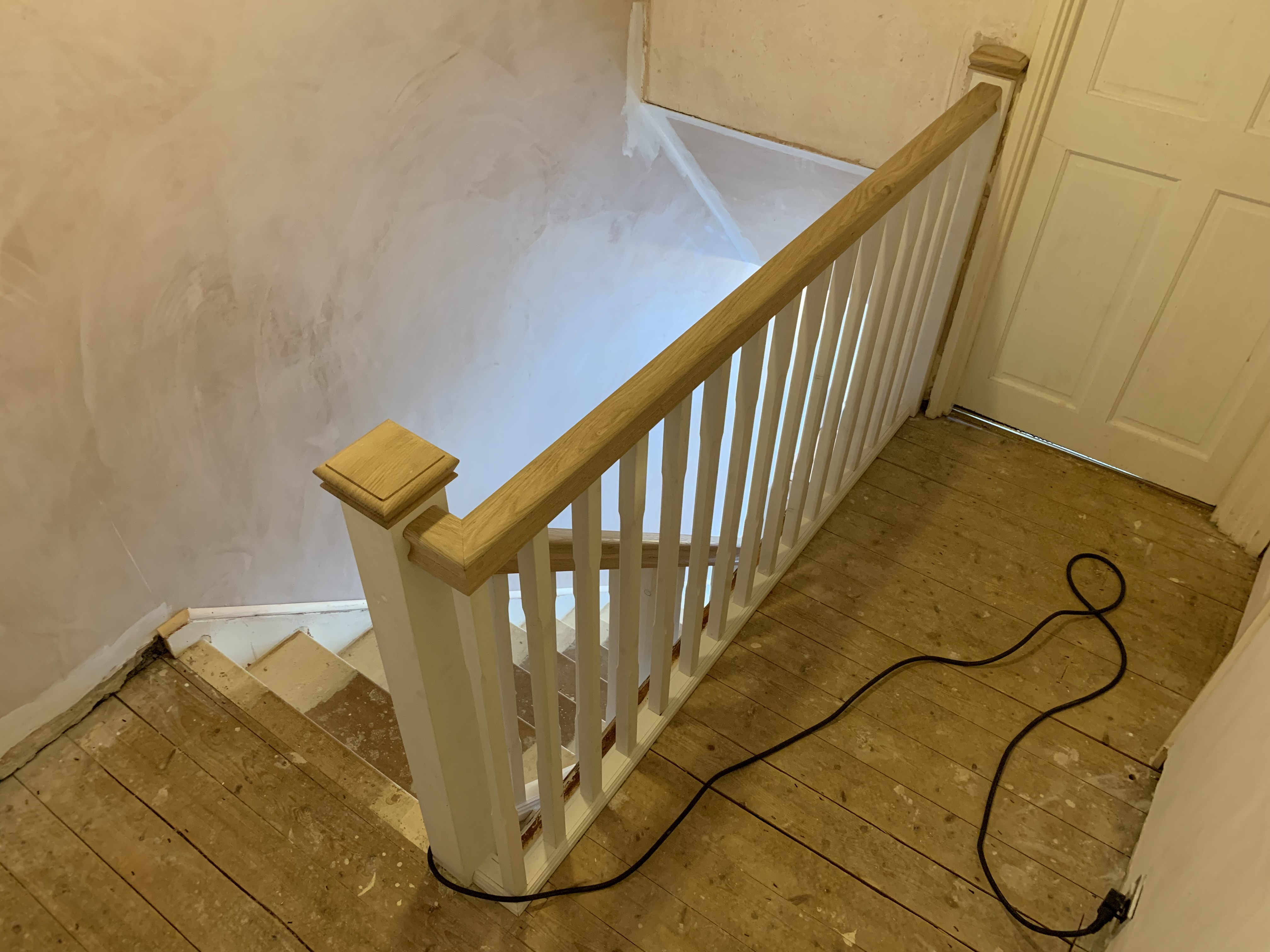 Oak handrail with primed stop-chamfered spindles and baserail