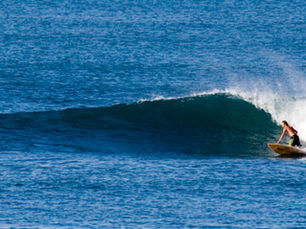 Surfer riding a wave at Santa Catalina, Panama — world-class surf destination near Lago Bay Airstrip