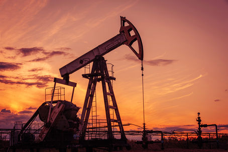 Oil pumpjack as sunset