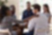 African psychologist supporting male rehab session participant put hand on newcomer should