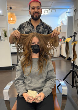 Zack Salcido installing natural-looking hair extensions at The Stone Fox Salon & Spa in West Seattle