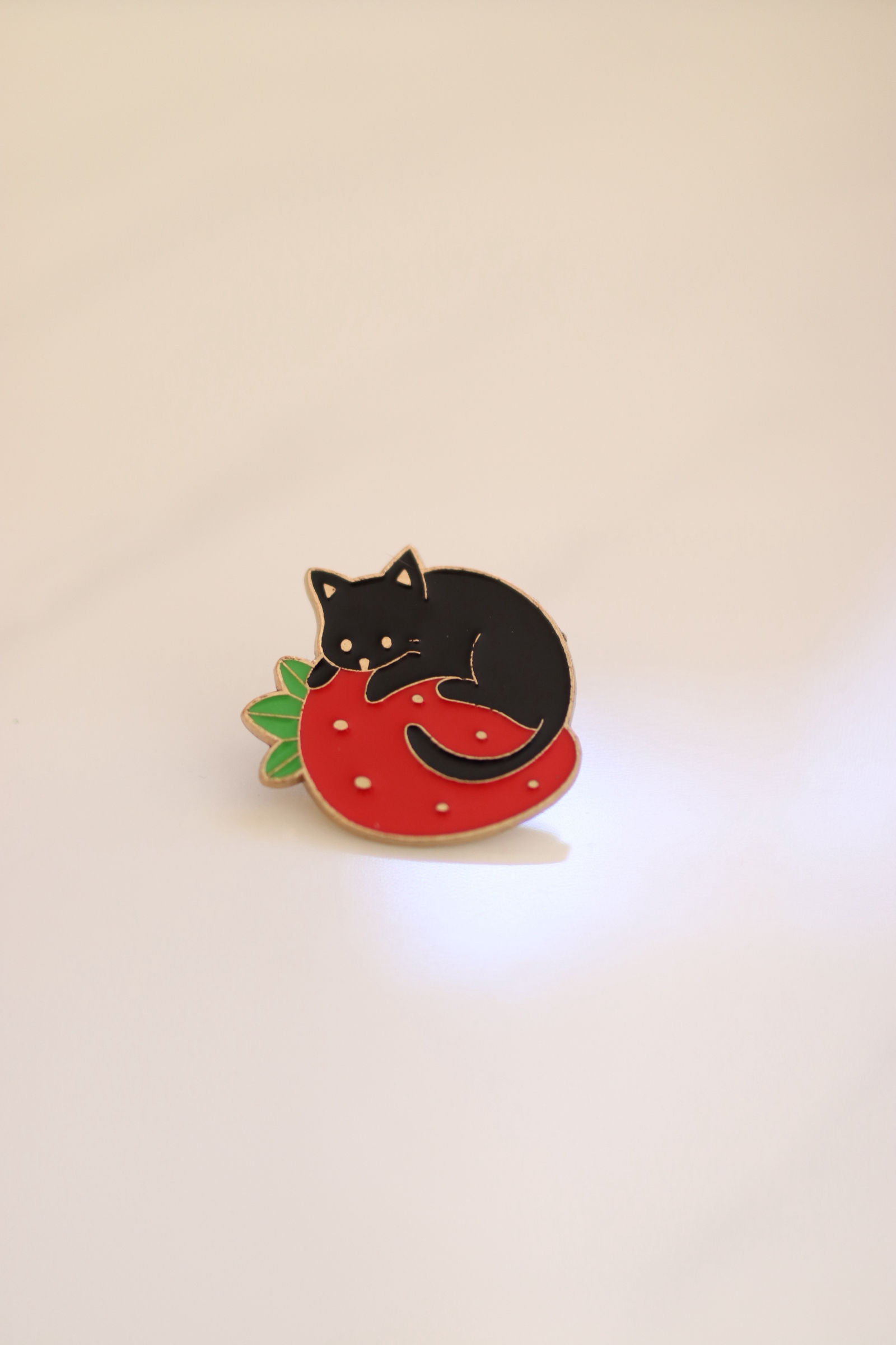 Cat and strawberry pin