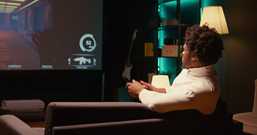 Man enjoying his new home theater installed by Front Row Theater in Fort Lauderdale Florida