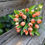 Thumbnail: Orange tulip bridal bouquet with soft green acacia