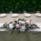 Eucalyptus Blush table arrangement with blush roses, hydrangea and eucalyptus greenery.