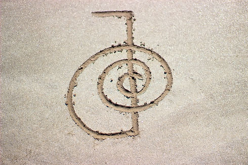 Reiki healing symbol cho ku rei on sand. Alternative medicine concept..jpg
