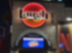 Laugh Factory and POP logo on side of building