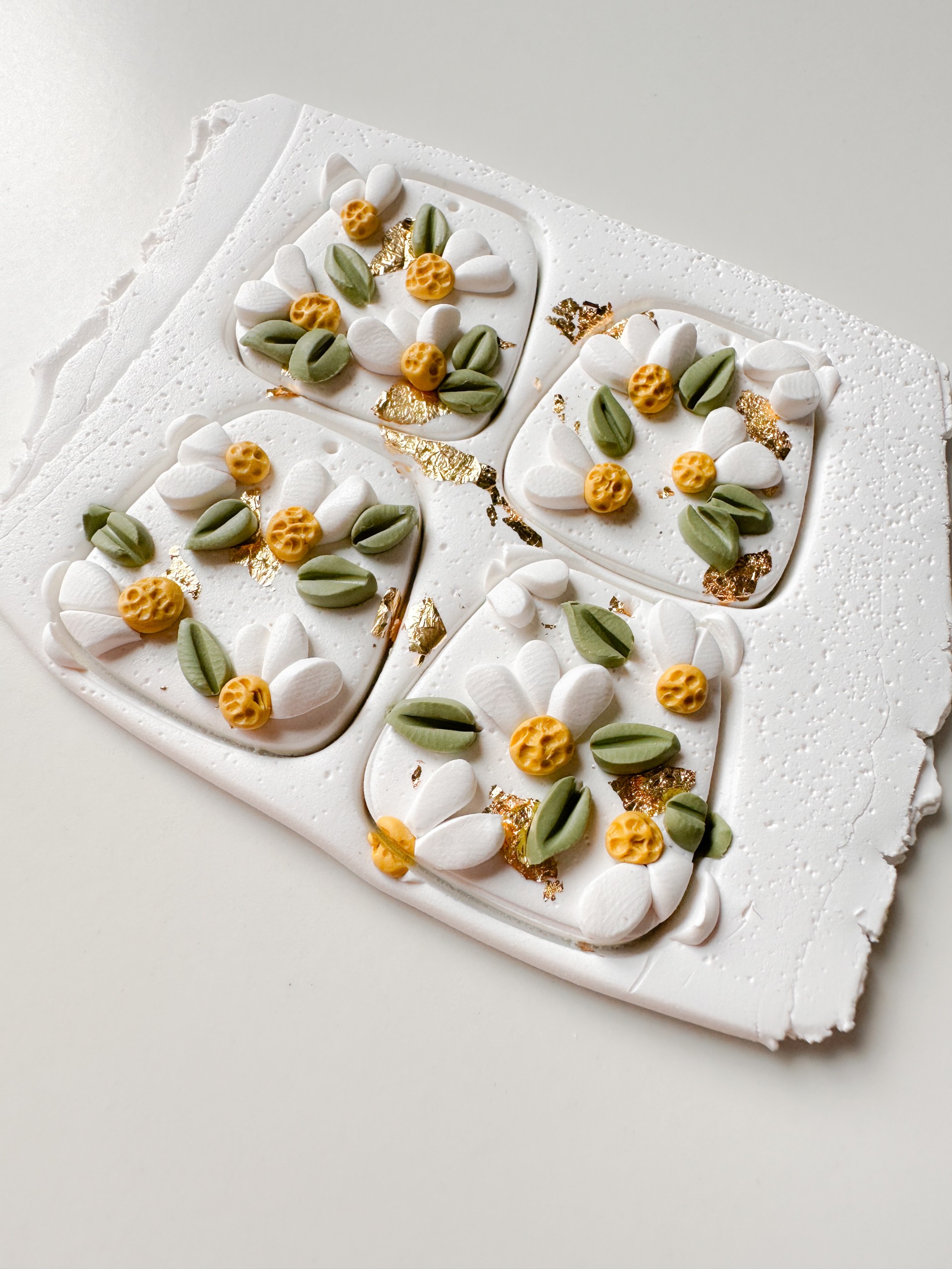 Softly lit handmade clay textures showcasing artisanal detail and earthy tones.