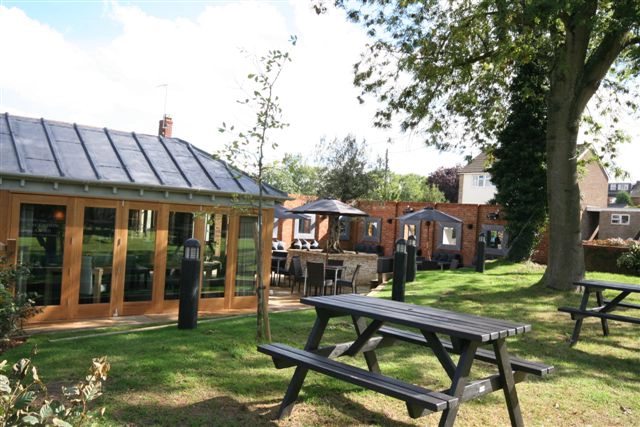 New gastropub with extensive enlargement and a hanging wooden fire.