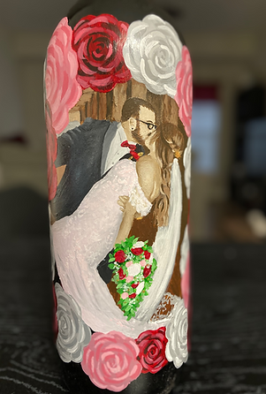 Hand-painted wedding kiss on wine bottle