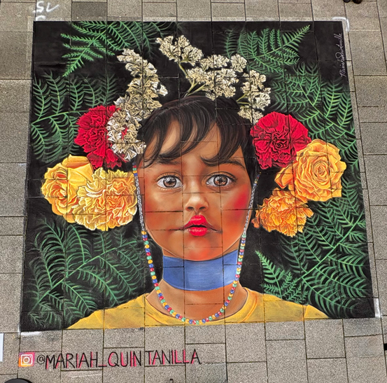 a large chalk drawing on the ground of a girl with flowers in her hair 