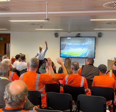Ryan delivering a workshop to a room full of men