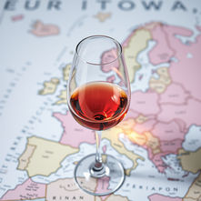 Glasses of red wine with organic European label vs California conventional label, highlighting pesticide differences