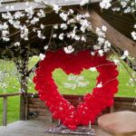 Red heart frame with white flowers, 
