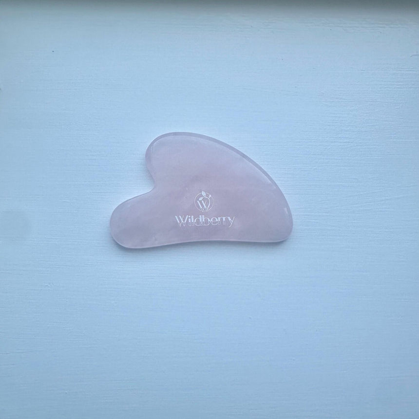 Pink Gua Sha, Wildberry Skincare, Natural Jade Gua Sha Tool, Anti-Aging Facial Sculpting on white surface