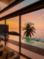 view-from-luxury-villa-sunset-sun-loungers-sunbathing-umbrellas-from-sun-pillows.webp
