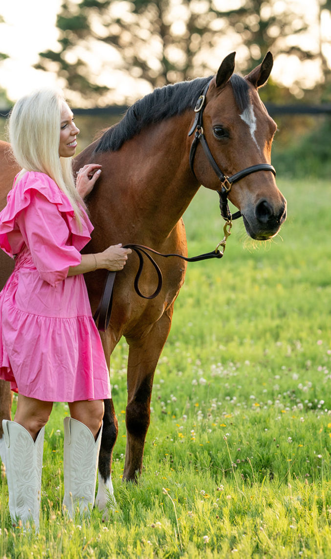 Here I am with 3/4 Arabian gelding JAG Khasanova scratching his shoulder and wither area and standing safely off to the side. Note I also have the lead rope folded in my hand - not wrapped around my fingers. It's important to stay aware of your posture and get to know the horse. Over time, you'll learn what each individual horse prefers and there will be nuance in how you interact with horses as you gain experience and knowledge! This was during a photoshoot with Sweet Fresno Photography/Erin Wheeler.