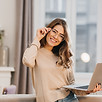 cute-girl-in-beige-shirt-touching-glasses-and-holding-laptop-with-smile.jpg