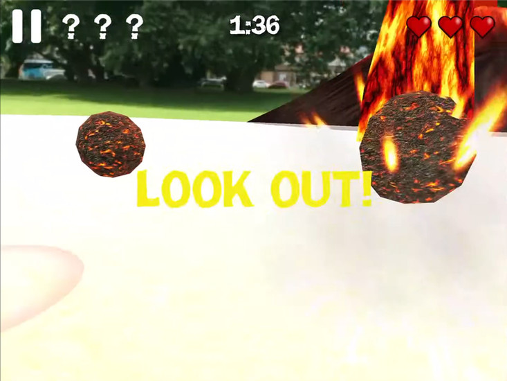 What's the Plan Stan game screenshot showing flaming boulders flying through the air with a Look Out warning during a volcanic eruption