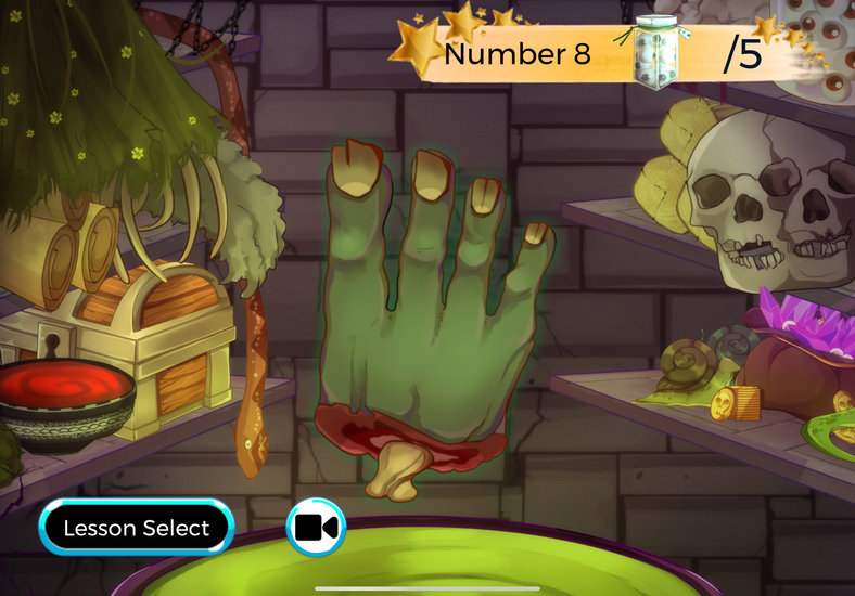 Wizard World of Numbers game screen showing a large animated green hand with eight fingers raised to represent Number 8, in a magical potion room setting