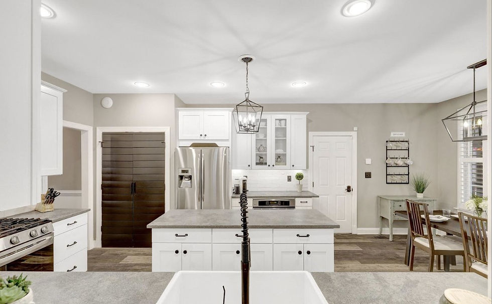 Spacious open kitchen in Aldie colonial with island seating and adjacent breakfast nook.