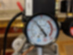 The pressure gauge on the air compressor shows the "psi"