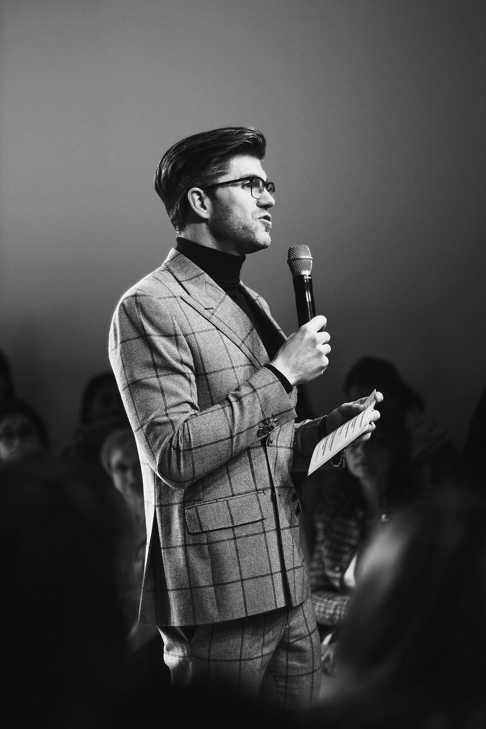 man standing while holding microphone_edited.jpg