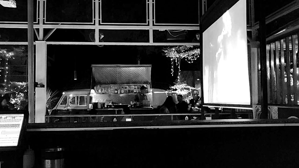 Interactive music video screens with background audio at Hangover Indiranagar Bengaluru