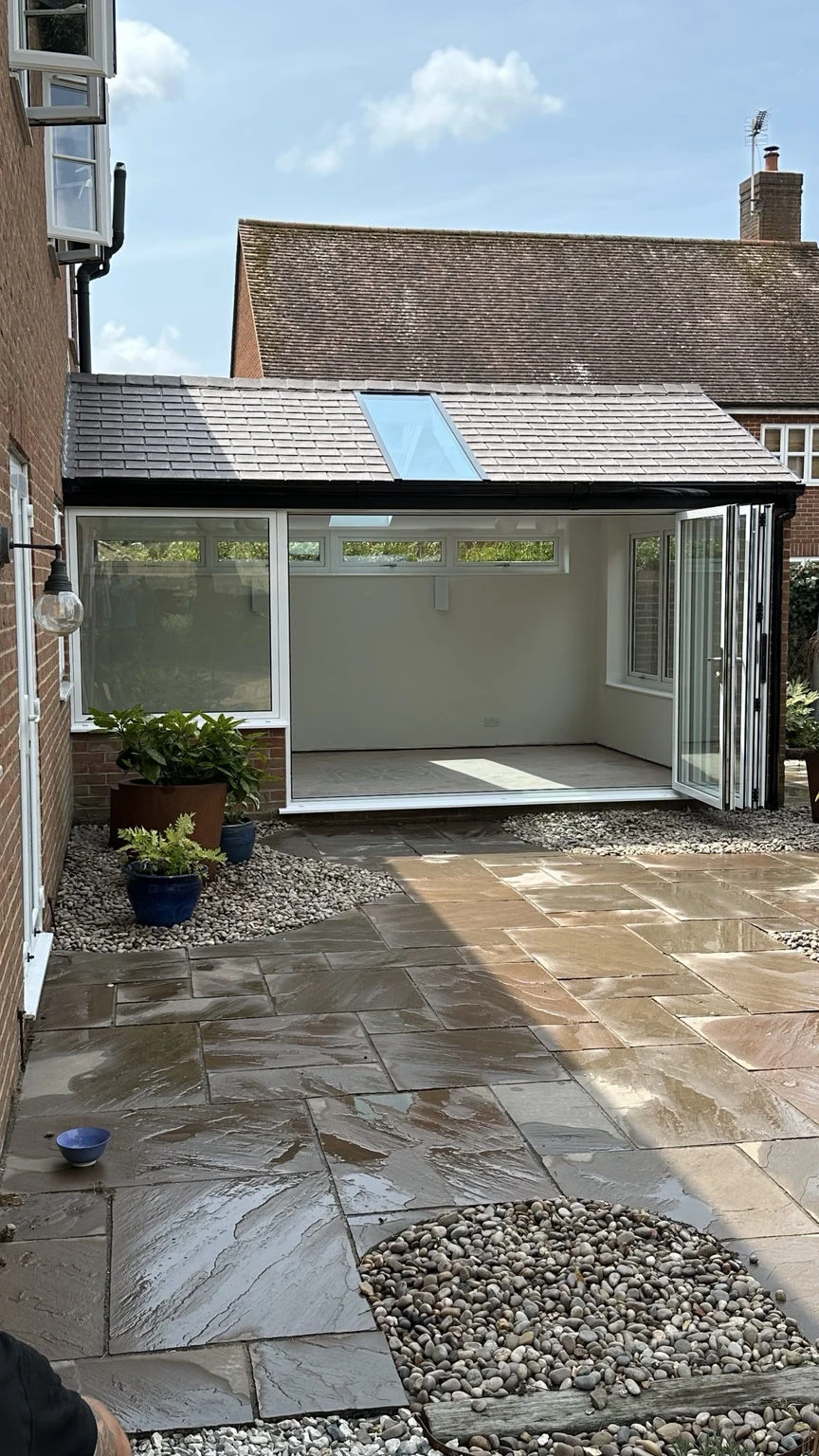 Concept Glazing's completed tiled conservatory roof, rooflight and open bifold doors