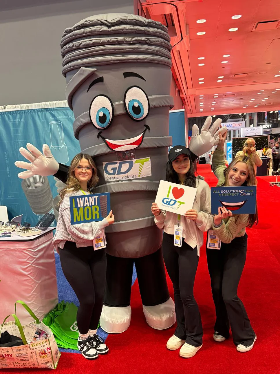 GDT Dental Implants Mascot with clients at Greater New York Dental Meeting 2024 