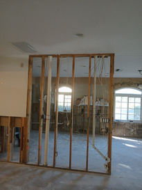 Interior wall framing exposed after flood damage demolition