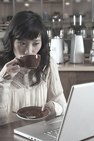 Woman Sipping Coffee