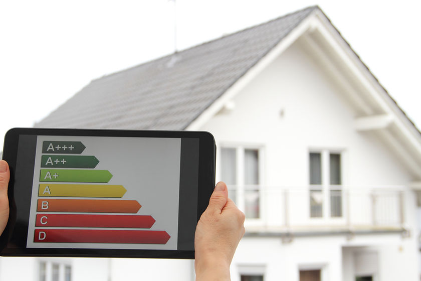 Energy label on a tablet with a house in the background.jpg