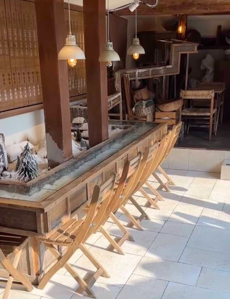 wooden cafe with chairs and lights
