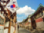 Bukchon Hanok Village, with a South Korea flag hanging on the building on the left