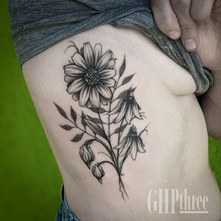 Freehand, blackwork, fine line, realism, stipple shading tattoo of a flower bouquet on the ribs by Gail Perry GHPthree
