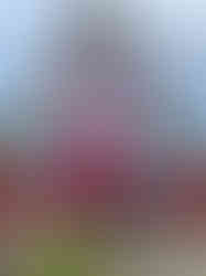 two girls standing in front of Santana house in Madeira Portugal