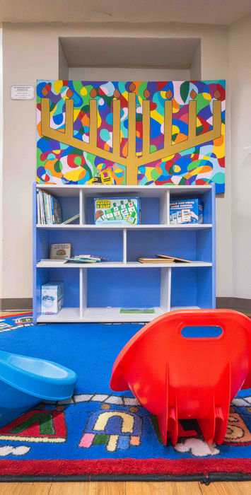 Children’s creative play area with colorful furniture at Temple Sinai early childhood program.