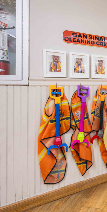 Temple Sinai hallway displaying colorful student artwork.