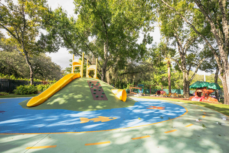 Children’s playground with slide and climbing structure at Temple Sinai.