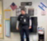 School security officer visiting a classroom and speaking with students at Temple Sinai.