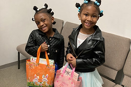 Smiling girls with colorful gift bags_ed