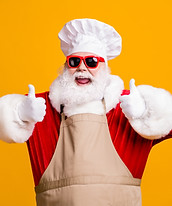 Crazy santa claus with beard in chef headwear cook show thumb up sign x-mas christmas holl