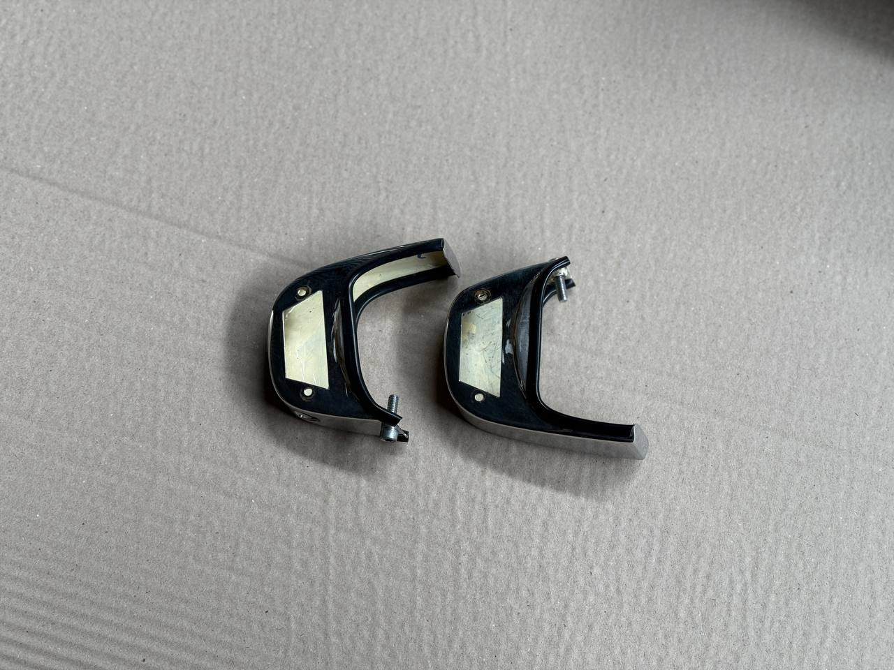Chrome housing for license plate lights, pair.