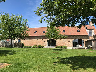 De tuin en achtergevel