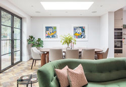 Curved Sofa with Dining Table Behind