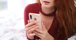 bigstock-Young-happy-woman-using-mobile-
