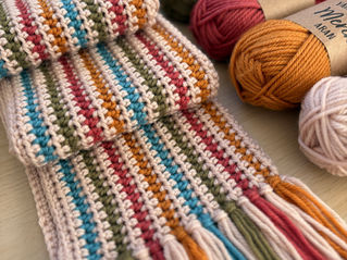 a colourful crochet scarf in merino yarn